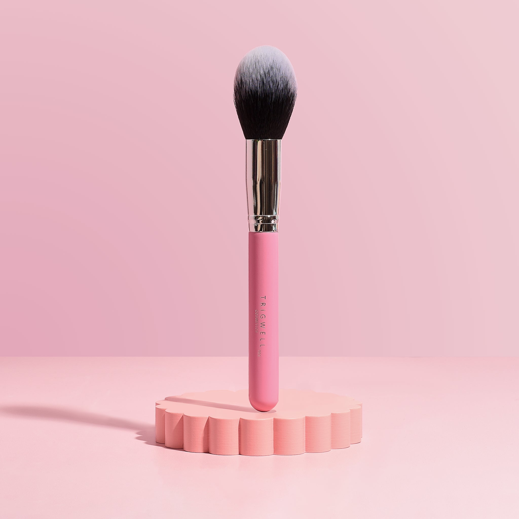 Image of T03 brush - a large fluffy powder brush with a pink handle 