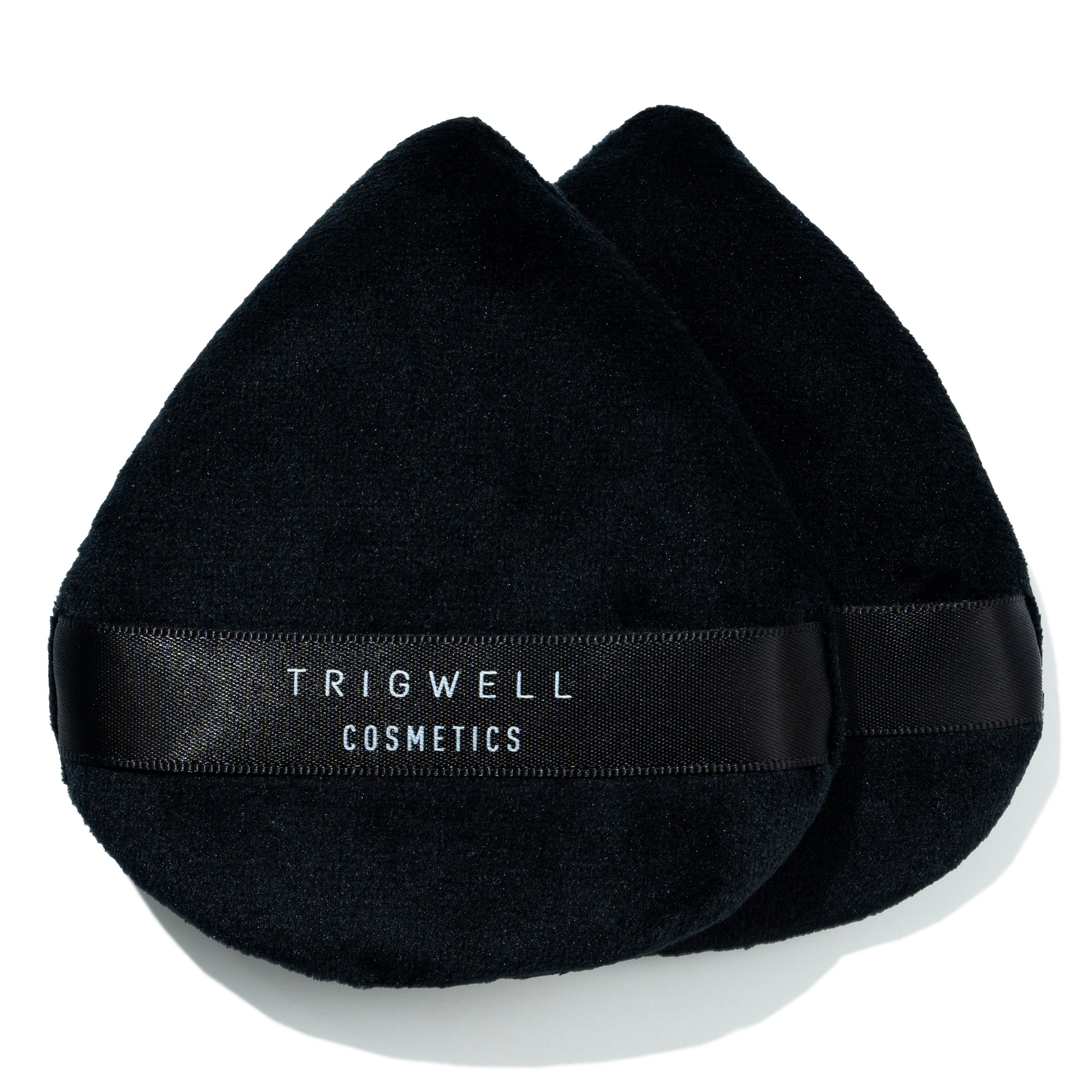 large powder puff with brand name 'Trigwell Cosmetics' printed in white text on the black ribbon of the powder puff 